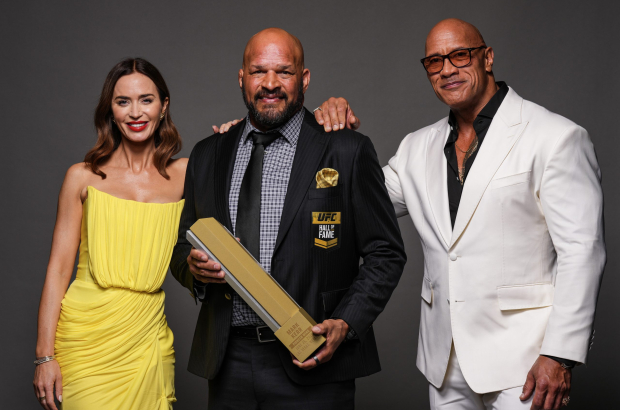 LAS VEGAS, NEVADA - JUNE 26: (L-R) Emily Blunt, Mark Kerr and Dwayne Johnson pose for a portrait backstage during the UFC Hall of Fame Class of 2025 Induction Ceremony at T-Mobile Arena on June 26, 2025 in Las Vegas, Nevada. (Photo by Mike Roach/Zuffa LLC)