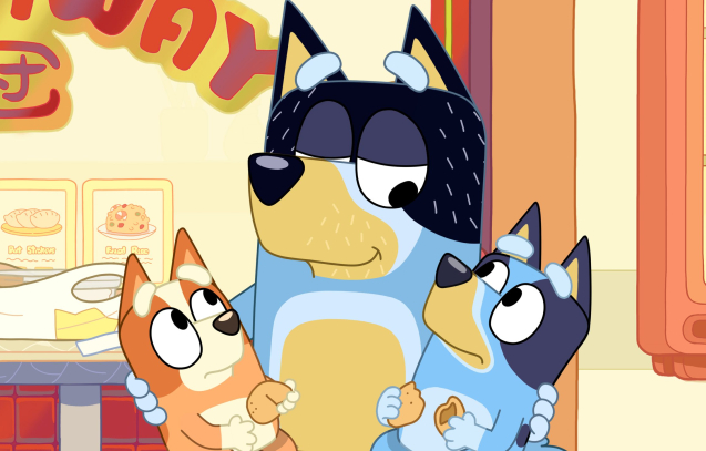 Dad shares a moment with Bingo and Bluey after reading the fortune cookie message