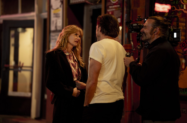 Laura Dern and Will Arnett with director Bradley Cooper on the set of IS THIS THING ON? Photo by Searchlight Pictures/Jason McDonald, Courtesy of Searchlight Pictures. © 2025 Searchlight Pictures All Rights Reserved.