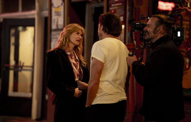 Laura Dern and Will Arnett with director Bradley Cooper on the set of IS THIS THING ON? Photo by Searchlight Pictures/Jason McDonald, Courtesy of Searchlight Pictures. © 2025 Searchlight Pictures All Rights Reserved.