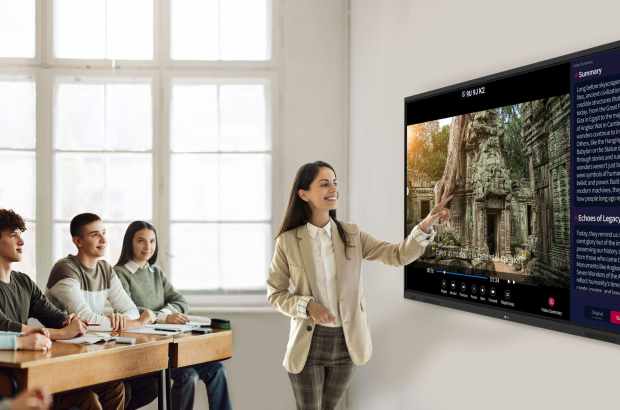 Large group of high school students listening to their teacher on a class in the classroom.