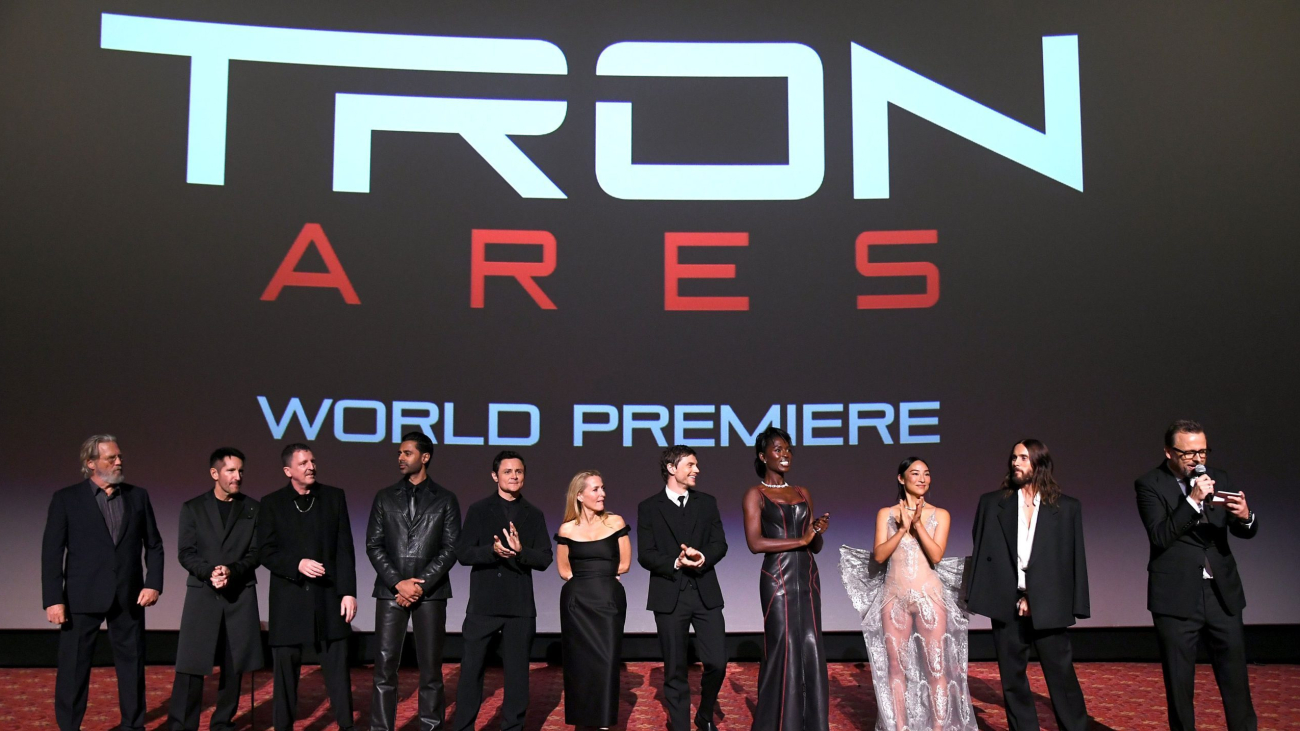 HOLLYWOOD, CALIFORNIA - OCTOBER 06: (L-R) Jeff Bridges, Trent Reznor, Atticus Ross, Hasan Minhaj, Arturo Castro, Gillian Anderson, Evan Peters, Jodie Turner-Smith, Greta Lee, Jared Leto and Joachim Rønning speak onstage during the World Premiere of Disney's Tron: Ares at the TCL Chinese Theater in Hollywood, CA on October 06, 2025.  (Photo by Alberto E. Rodriguez/Getty Images for Disney)