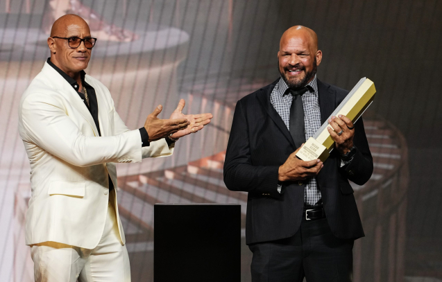 LAS VEGAS, NEVADA - JUNE 26: (L-R) Dwayne Johnson presents the UFC Hall of Fame trophy to Mark Kerr during the UFC Hall of Fame Class of 2025 Induction Ceremony at T-Mobile Arena on June 26, 2025 in Las Vegas, Nevada. (Photo by Jeff Bottari/Zuffa LLC)